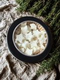 lotion dots in a black tin 