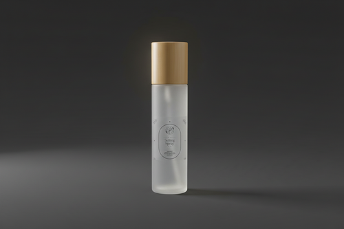 Clear spray bottle with wooden cap on a wooden surface